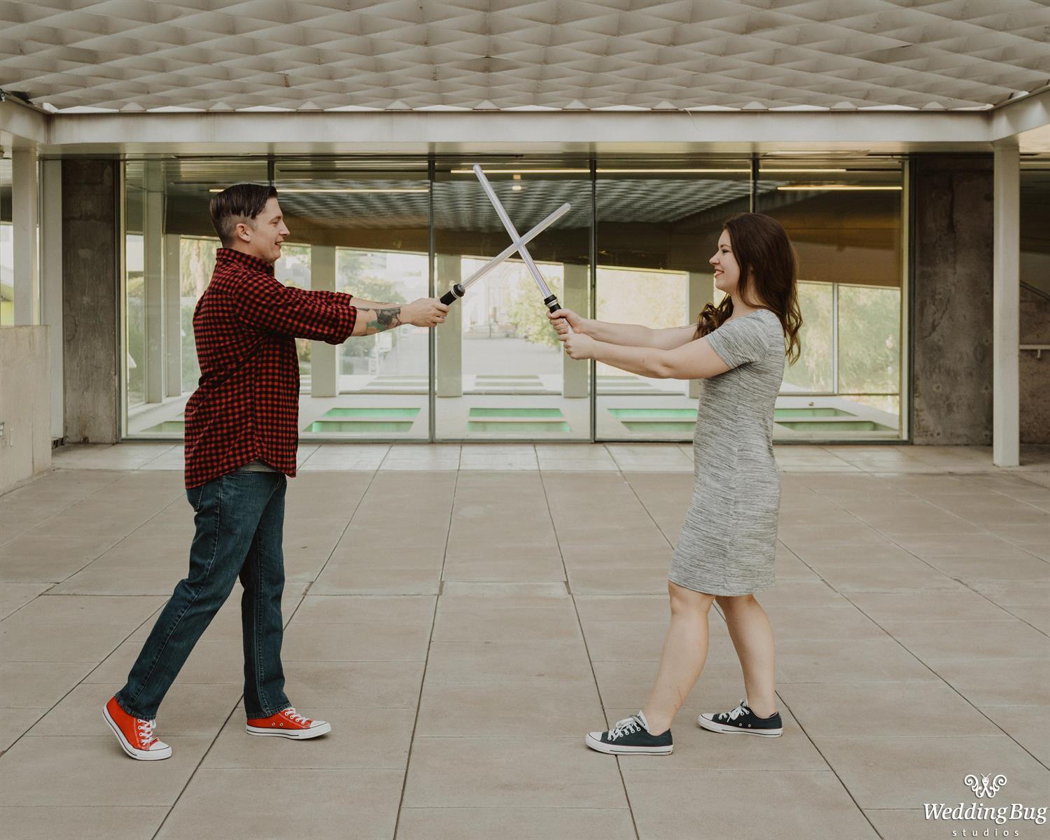 Fun Engagement Photo with Lightsabers